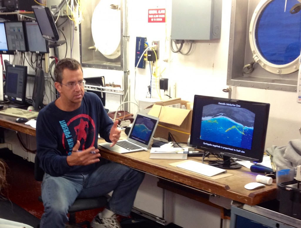 Figure 4. Tim Melbourne (Central Washington University) explains the GPS component of the Cascadia Initiative during an onboard science meeting.